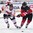ZUG, SWITZERLAND - APRIL 26: Canada's Tyler Benson #21 and Switzerland's Robin Fuchs #21 chase down a loose puck during bronze medal game action at the 2015 IIHF Ice Hockey U18 World Championship. (Photo by Matt Zambonin/HHOF-IIHF Images)

